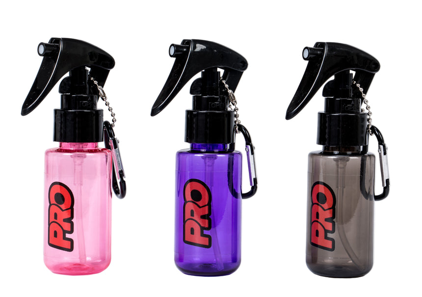 Three spray bottles with 'PRO' branding on a white background