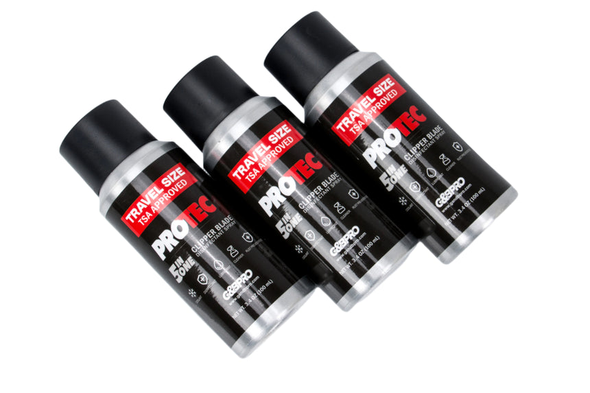 Three Pro-Tec travel size aerosol cans on a white background