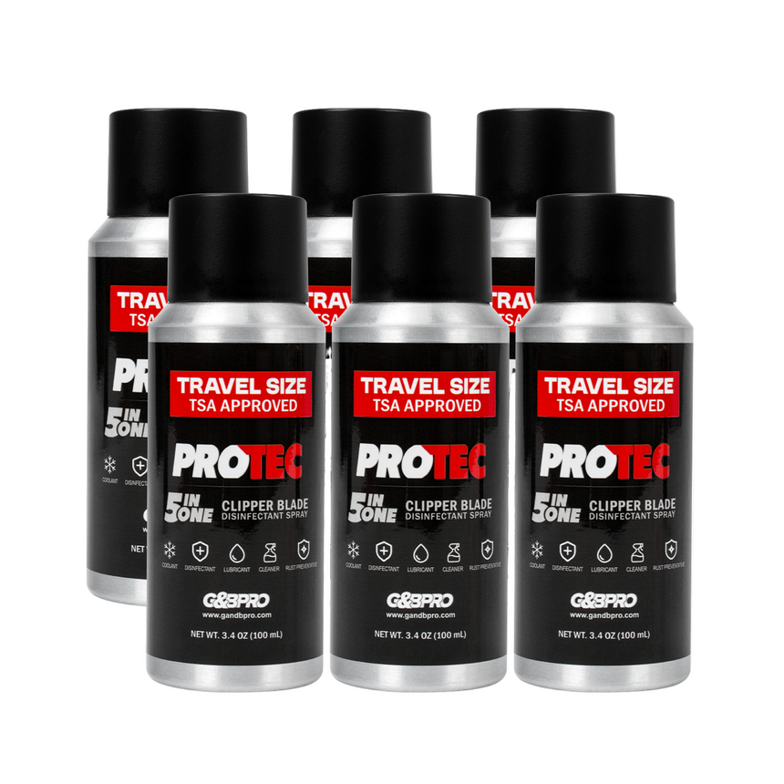 Six travel-sized PROTEC clipper blade spray bottles on a white background