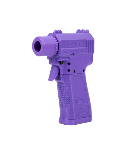 Purple toy gun on a white background